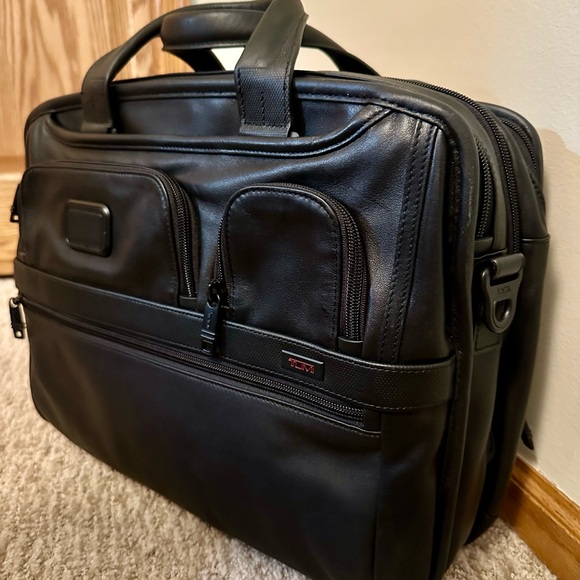 Tumi Black Travel Bag with Structured Design and Expandable...